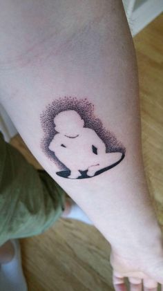 a person with a small tattoo on their arm