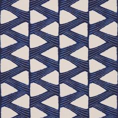 an abstract blue and white pattern on fabric