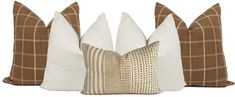 three decorative pillows on white background with brown and tan stripes, one in the middle