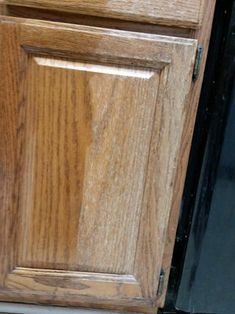 a close up of a wooden cabinet door