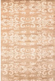 a beige rug with an intricate design on it