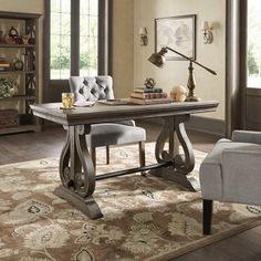 a living room with a couch, chair and bookcase in the middle of it