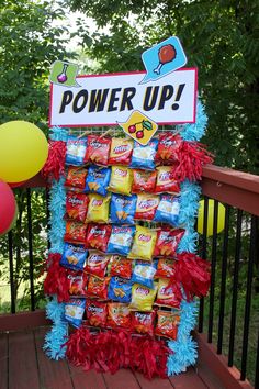 a candy bar display on a deck with balloons