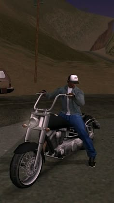 a man sitting on top of a motorcycle next to a car and another person holding a cell phone