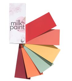 various colors of paper with the words milk paint on it and a white box in the middle