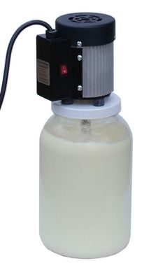 a white bottle with a black cap and an air pump attached to the top, on a white background