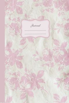 a pink and white flowered paper with a name tag on the bottom right corner