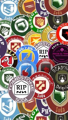 many different colored badges are arranged together