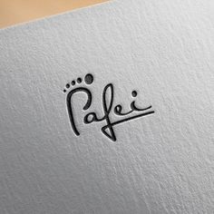 an arabic calligraphy logo with the word alfei written in cursive writing