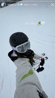 a person wearing skis and goggles in the snow