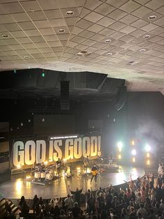 a large group of people standing on top of a stage in front of a crowd