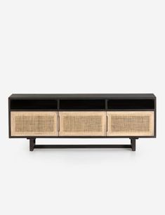 the sideboard with three drawers is made from wood and black lacc, it has two