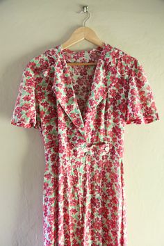 "Stunning vintage 1950's dress in incredible condition. The cut of this dress is so flattering, easy to wear everyday or for a special occasion. It is pinned on a size 8 uk but is more of a 10-12 - measurements are waist up to 30\" bust up to 38\"" Vintage V-neck Dress For Garden Party, Vintage Cotton V-neck Dress, 1950s Style Vintage Pattern Day Dress, Cotton Vintage Print Dress For Daywear, Cotton Vintage Dress With Vintage Print For Daywear, 1950s Style Cotton Vintage Dress For Summer, 1950s Cotton Dress With Vintage Pattern, 1950s Vintage Pattern Cotton Dress, 1950s Style Cotton Dress For Garden Party