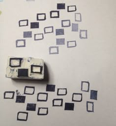 a piece of paper that has been cut into squares and rectangles on it