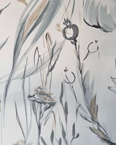 an abstract painting of grass and flowers on a white wallpapered room with neutral colors