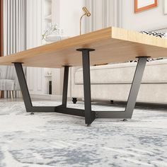 a wooden table sitting on top of a living room floor