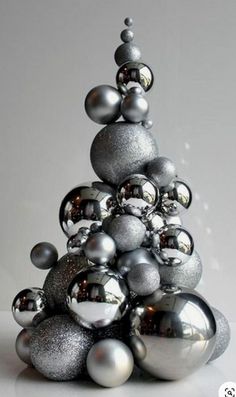 a christmas tree made out of silver balls