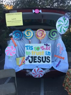 the back of a car decorated with lollipops and candies for jesus