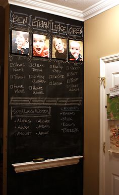 a chalk board with pictures on it in a kitchen