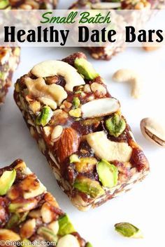 small batch healthy date bars with nuts and cashews on the top, in front of them