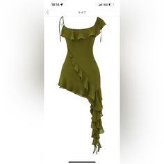 a green dress with ruffles on the bottom