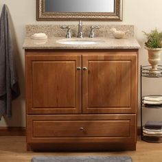 a bathroom vanity with a mirror above it