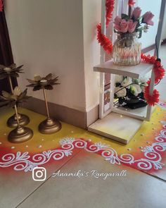 two vases filled with flowers sitting on top of a yellow and red carpeted floor