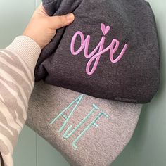 If it isn't monogrammed, is it really even yours? Our embroidered monogram sweatshirts are cozy and soft. ♥ AS SEEN IN LISTING PHOTOS ♥ - Dark Heather Sweatshirt, Kellen font, Lavender thread - Sport Gray Sweatshirt, Farmhouse font Aqua thread ♥ DETAILS ♥ - Crewnecks are true unisex in size. - 7.8-ounce, 50/50 cotton/poly fleece. - Due to stock issues with suppliers, different brands may be used to fulfill orders. Gildan/Port & Company/Jerzees are the brands we normally use, unless otherwise noted in the listing. All sweatshirts used will be high quality.    ♥ QUESTIONS? ♥ - Send me a message through Etsy messages and I will be happy to help. Please allow 24 hours for a response; if you do not hear back within 24 hours please send me an updated message.  ♥ STAY SOCIAL ♥ - VIP Group - https Ladies Christmas Shirts, Monogram Sweater, Monogram Hoodie, Christmas Movie Shirts, Monogram Sweatshirt, Christmas Gifts For Grandma, Embroidered Monogram, Embroidery Monogram, Trendy Halloween