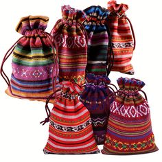 several colorful bags are lined up on a white background