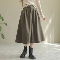 Details: Gender: Women Item Type: Skirt Material: Wool Season: Spring, Autumn Pattern: Solid Style: Casual, Loose, Retro Waist Type: Elastic Waist Size: One Size Waist: 64.00 - 84.00 cm/ 25.20 - 33.07 " Length: 77.00 cm/ 30.31 " Hip: 126.00 cm/ 49.61 " Hem: 184.00 cm/ 72.44 "