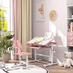 a child's desk and chair in a pink room