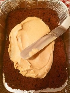 a cake in a pan with a knife on top