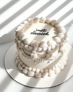 a white cake sitting on top of a table