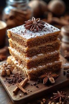 a stack of cake sitting on top of a wooden cutting board next to an assortment of spices