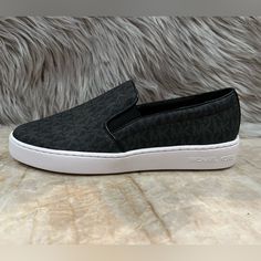 Our Sleek Slip-Ons Go From Day To Night And Work To Weekend Without Fuss. We Finished This Sneaker In Our Signature Logo Print And Added A Supportive Sole For Easy Wear. Team Them With A Feminine Skirt For A Casual-Cool Pairing. Round Closed-Toe Sneakers With Elastic Gores At Sides For Slip-On Comfort Mk Stitched Logo Detail At Upper Manmade/Leather Upper; Rubber Sole Imported Feminine Skirt, Michael Kors Black, Signature Logo, Slip Ons, Easy Wear, Sneakers Black, Logo Print, Rubber Sole