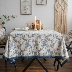 the table is set with two chairs and a candle