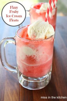 two glasses filled with ice cream on top of a wooden table