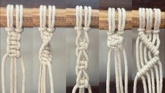 four different ropes hanging from a wooden pole