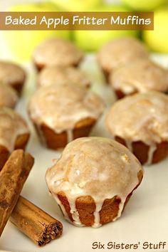 baked apple fritter muffins on a plate with cinnamon sticks