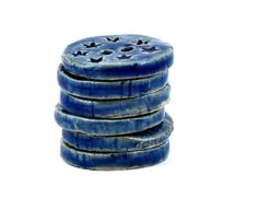 a stack of blue ceramic coasters sitting on top of each other