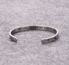 Sisters Jewelry, Not sisters by blood but sisters By Heart, Sisters Cuff, Sister Gift, Sister Bracelet, Sister Jewelry, Friendship Bracelet This is the perfect cuff for the special friend in your life.   Not sisters by blood but sisters By Heart, stamped on the inside of the cuff with a double heart stamped on the front sides. Details: Stainless Steel Size: 6mm width, 62mm inner diameter, 32mm opening Your order will be conveniently sent packaged in pretty organza bag with sentiment card.  If th Silver Friendship Bracelets, Soul Sisters Gifts, Heart Bangle Bracelet, Sister Bracelet, Sisters By Heart, Sister Jewelry, Friendship Jewelry, Inspirational Bracelets, Friend Bracelets