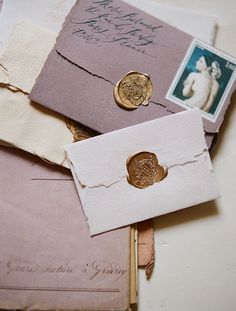 an envelope with two waxed stamps and some other items