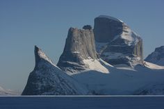 the mountains are covered in snow and ice