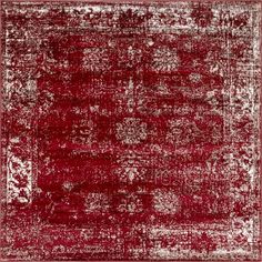 a red and white rug with an ornate design