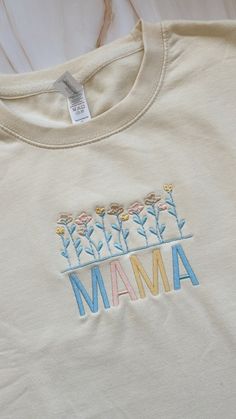 Embroidered light cream colored crewneck or t-shirt with flower design Each item is made to order so slight variations may occur  Please message me to customize your order! Light Cream, Embroidered Tshirt, Chicago Il, Flower Design, Cream Color, Flower Designs, Mother's Day, Gender Neutral, Mothers Day