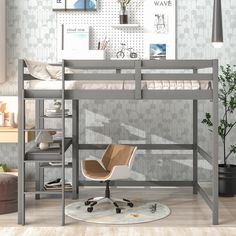 a loft bed with desk and chair in the corner, next to a wallpapered room