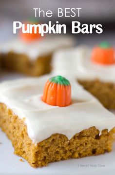 the best pumpkin bars with frosting and mini pumpkins on top are ready to be eaten