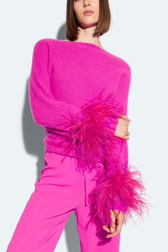 Featured in the Holiday 25 Collection Feather cuffs with adjustable interior button. Can be expanded to pair back to or tops and sweaters. Material: 100% Dyed Ostrich Feather, Struthio Camelus, Republic of South Africa Fit: Flexible. One size Care: Professional Care Only Pink Feather Trim Outerwear For Fall, Feather Sweater, Hot Pink Feather Top, Feather Trim Sweater, Tulle Coat, Pink Fur Trim Cardigan, Feather Jacket, Dress Satin, Runway Collection