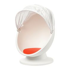 an egg chair with a white cover on it's head and red seat cushion