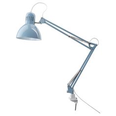 a light blue desk lamp on a white background with clippings to the side